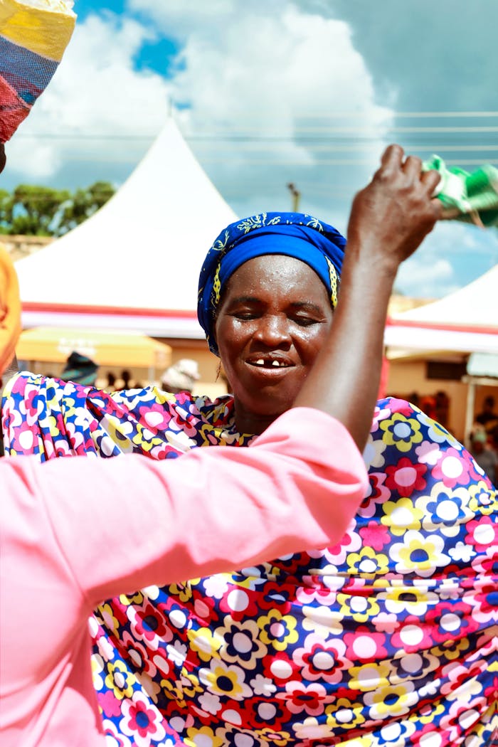 Elderly woman celebrates joyfully at a cultural event in Nalerigu, Ghana.